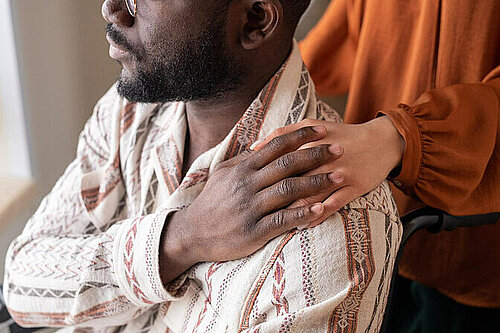 Worried person being comforted